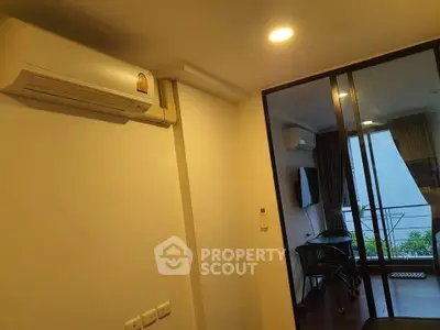 Modern apartment interior with air conditioning and balcony view