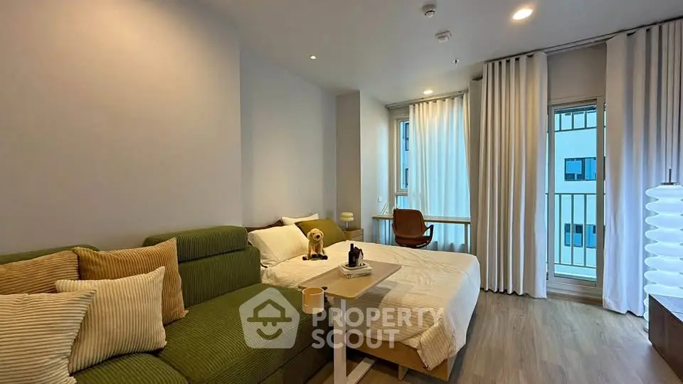 Modern studio apartment with cozy living area and stylish decor