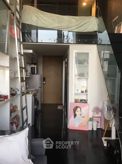 Modern loft apartment with mezzanine, sleek kitchen, and stylish decor