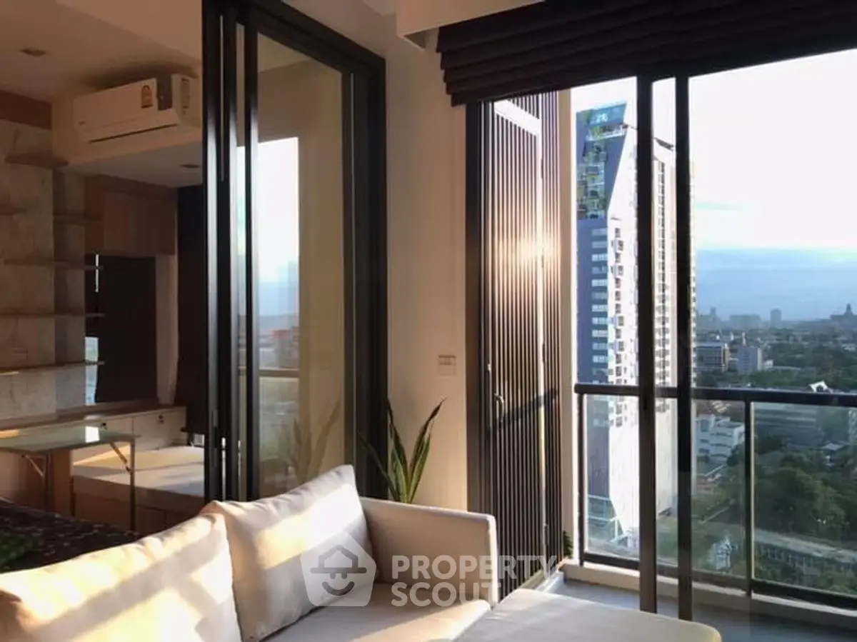 Modern living room with stunning city view and spacious balcony