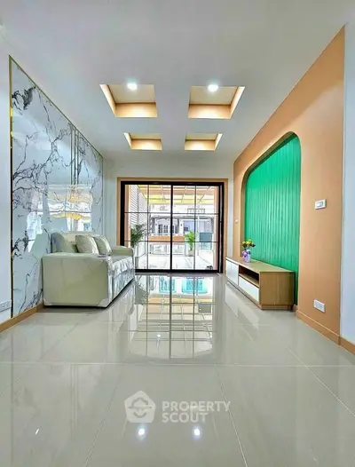 Modern living room with marble accent wall and stylish ceiling lights