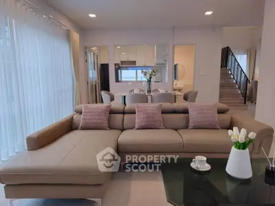 Spacious modern living room with elegant sectional sofa and stylish decor