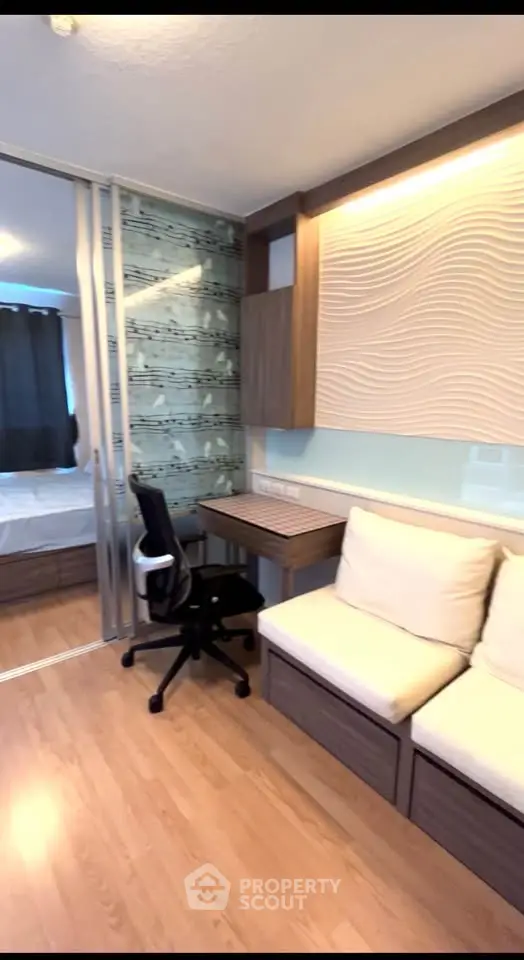 Modern studio apartment with stylish decor and sliding glass partition