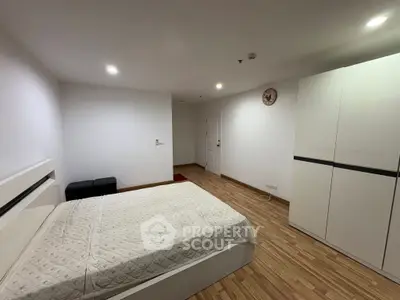 Spacious bedroom with modern design and ample storage space