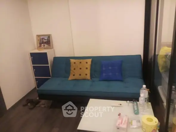 Cozy living room with modern blue sofa and stylish decor