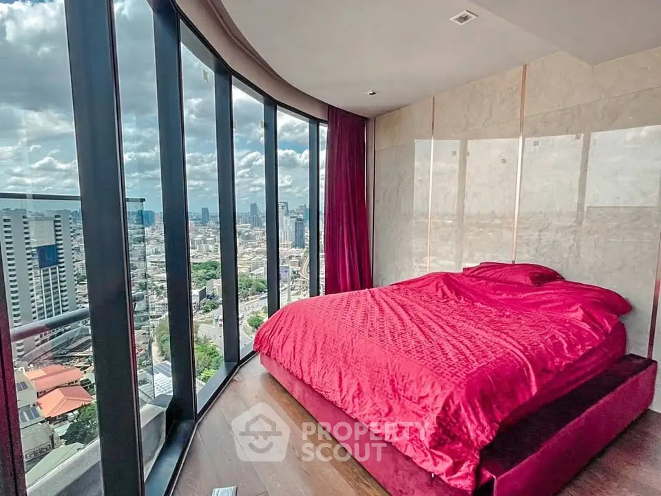 Luxurious bedroom with panoramic city views and floor-to-ceiling windows