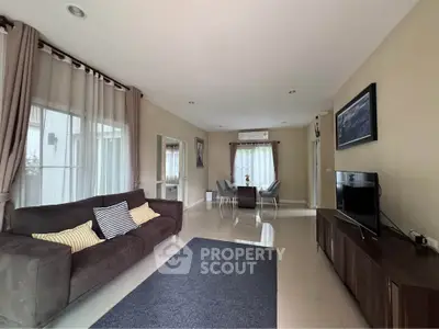 Spacious modern living room with elegant decor and ample natural light