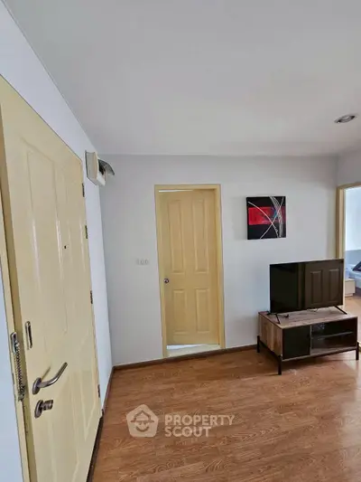 Modern living room with wooden flooring and stylish decor