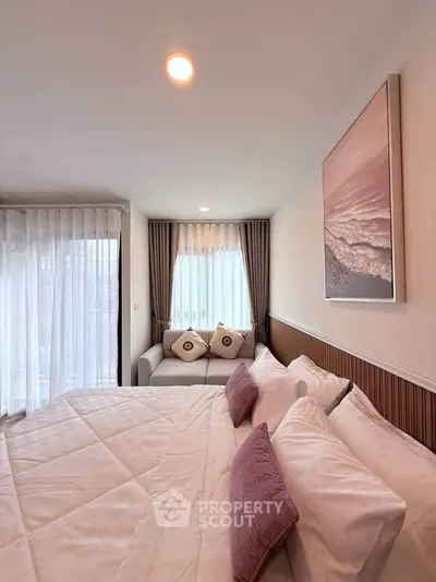 Elegant bedroom with cozy decor and natural light, featuring a comfortable bed and stylish curtains.