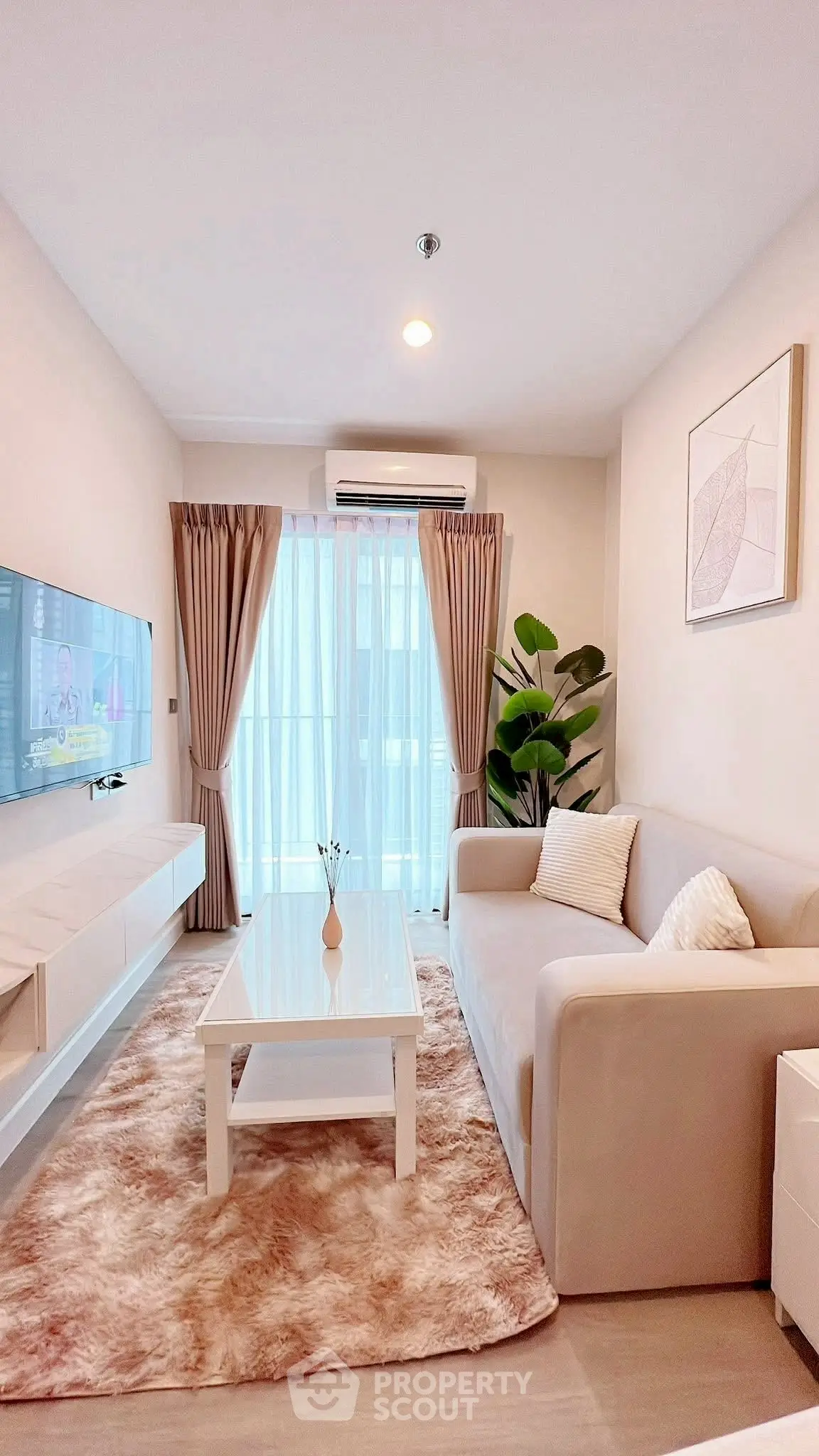 Chic modern living room with cozy sofa, stylish decor, and natural light.
