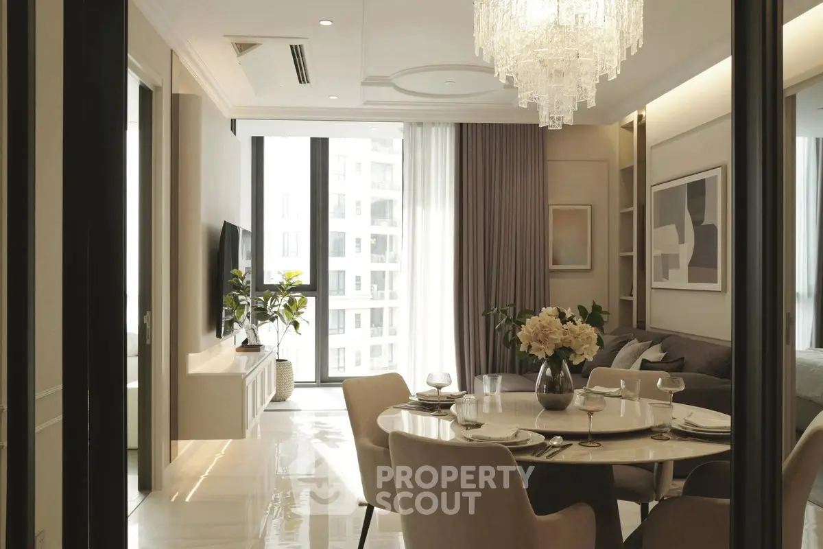 Luxurious living room with elegant dining area and chandelier in modern apartment