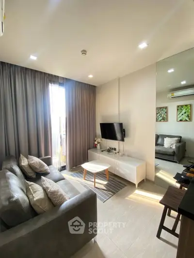 Modern living room with sleek furniture and natural light