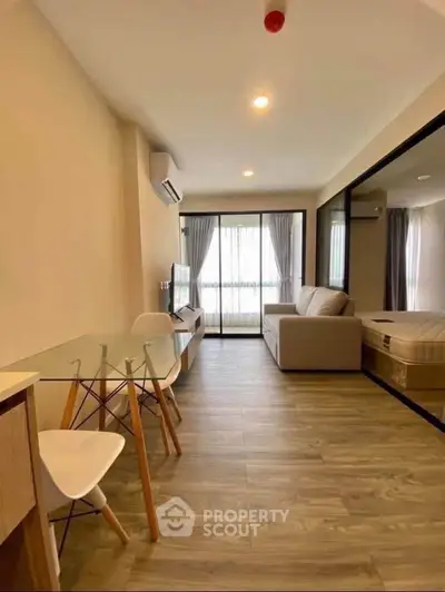 Modern living room with open layout and stylish furniture in a cozy apartment.
