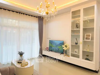 Elegant living room with chandelier and modern decor