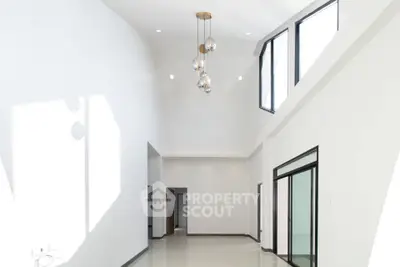 Spacious modern interior with high ceilings and large windows