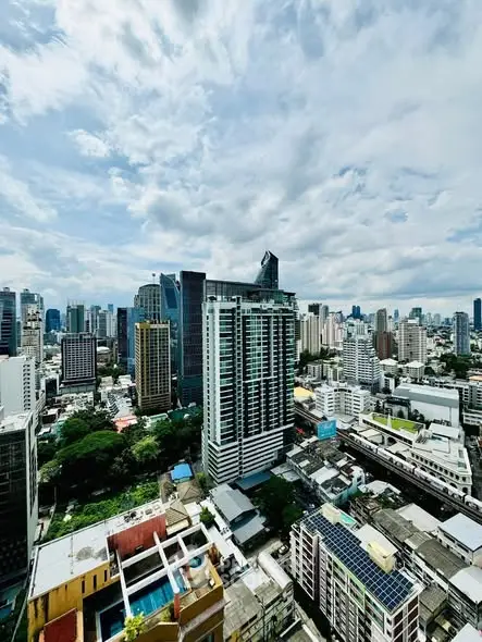 Stunning cityscape view showcasing modern high-rise buildings under a vibrant sky.
