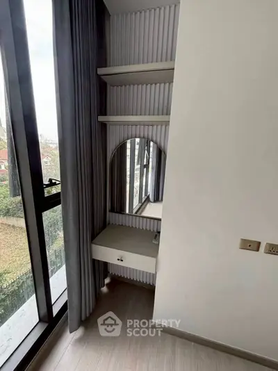 Modern bedroom corner with vanity and large window view