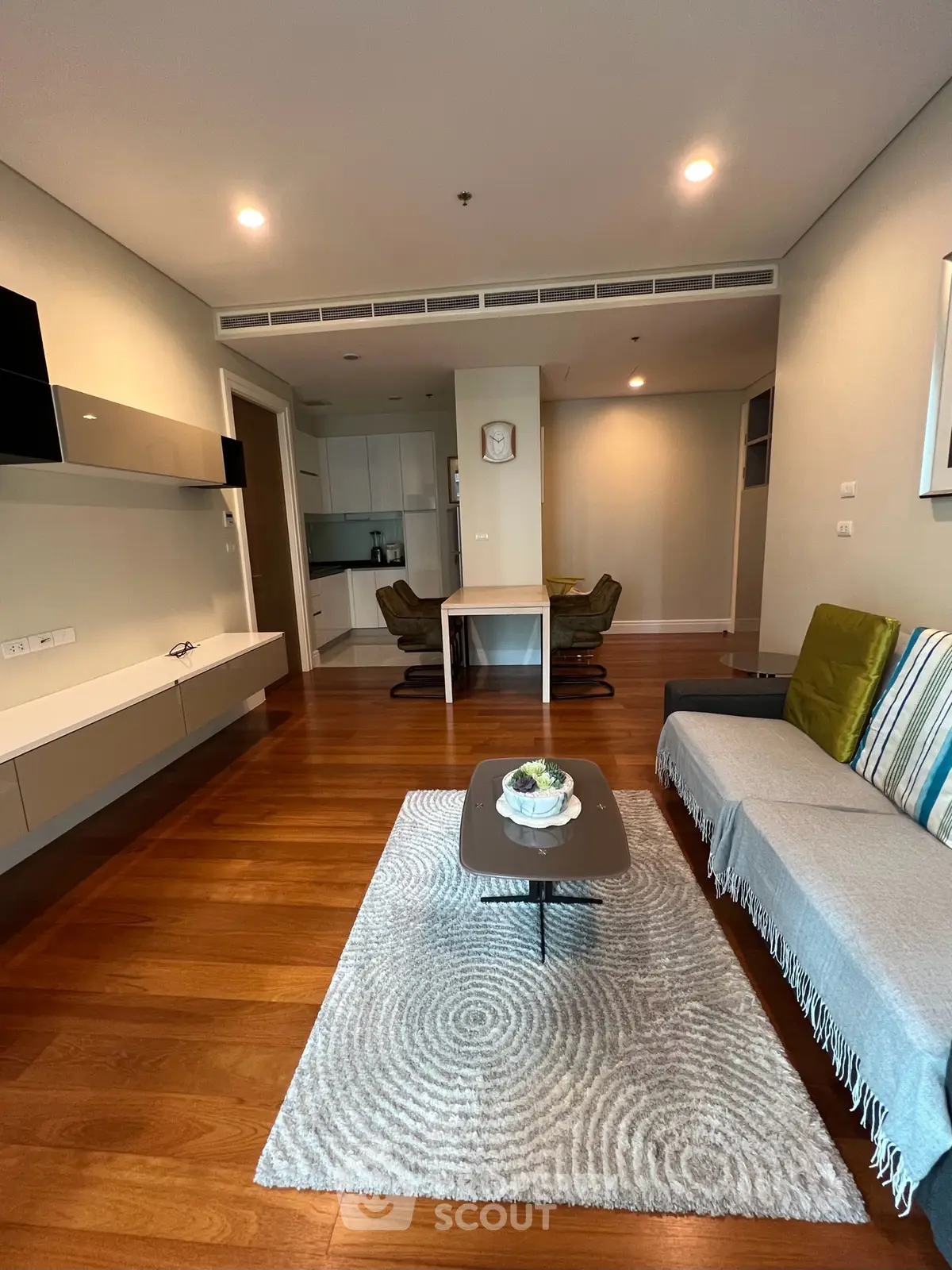 Spacious modern living room with open kitchen and stylish decor