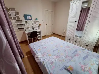 Charming bedroom with cozy decor and ample storage, perfect for a restful retreat.
