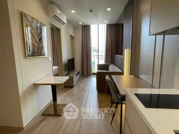 Modern living room with sleek design and city view, featuring stylish furniture and open layout.