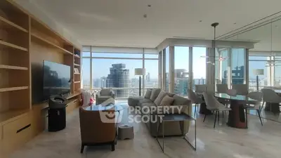 Luxurious modern living room with stunning city view and elegant furnishings.
