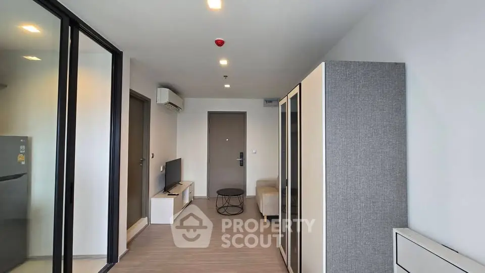 Modern apartment interior with sleek design and minimalist furniture, featuring a cozy living area and stylish decor.