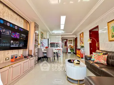 Luxurious open-plan living room with modern decor and spacious dining area, perfect for entertaining guests.