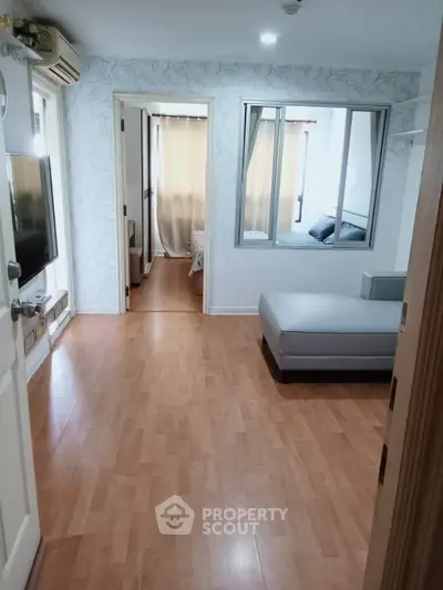 Spacious apartment interior with wooden flooring and modern decor