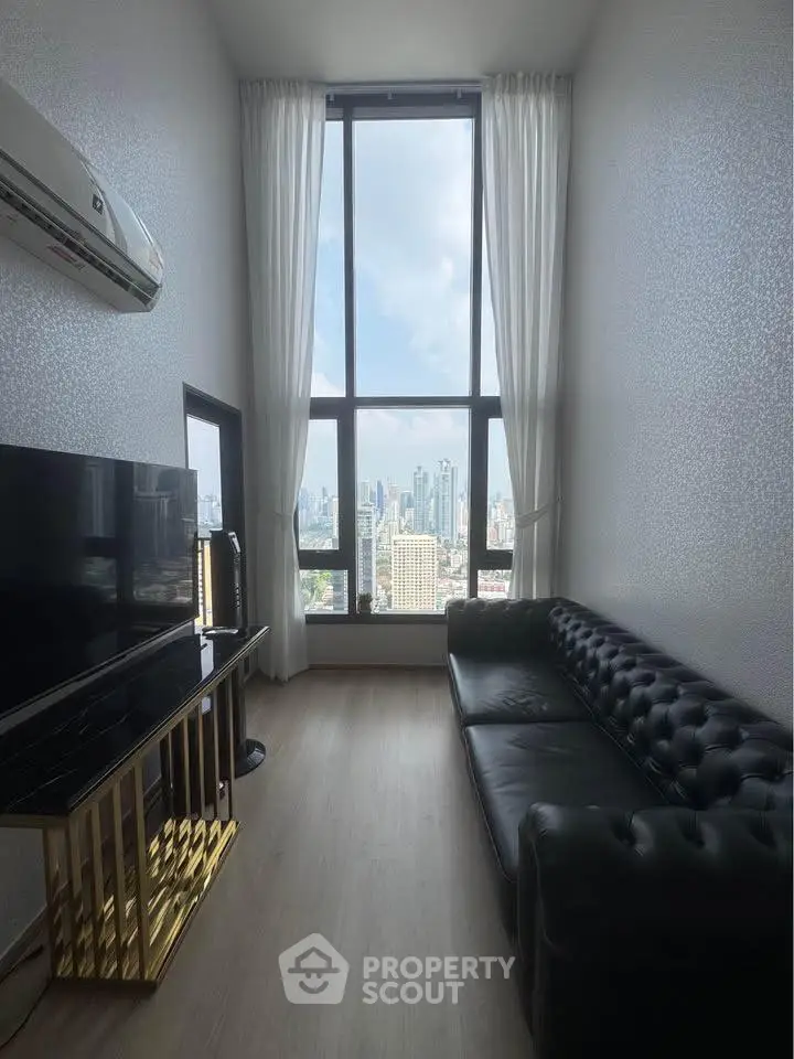 Luxurious living room with stunning city view and elegant black leather sofa.