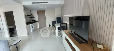 Modern living room with sleek furniture and integrated kitchen appliances