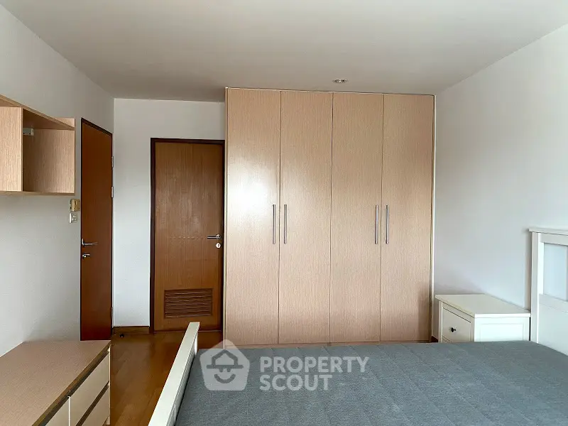 Spacious bedroom with modern wardrobe and minimalist design