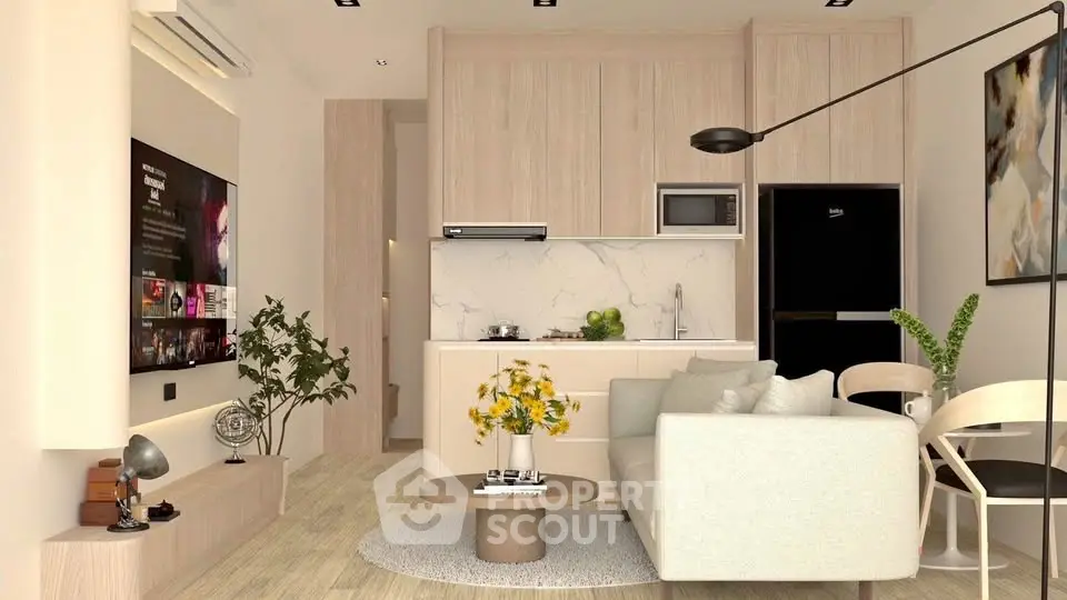 Modern living room with open kitchen, stylish decor, and cozy seating area.