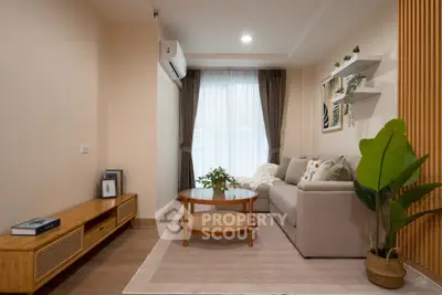 Stylish living room with modern decor, cozy sofa, and natural light for a welcoming ambiance.