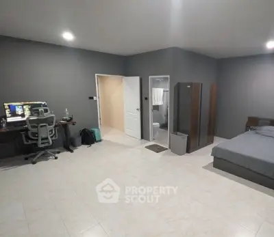 Spacious modern bedroom with study area and ensuite bathroom, ideal for comfortable living.