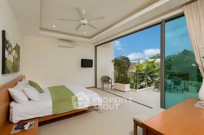 Luxurious bedroom with balcony offering stunning garden views and modern decor.