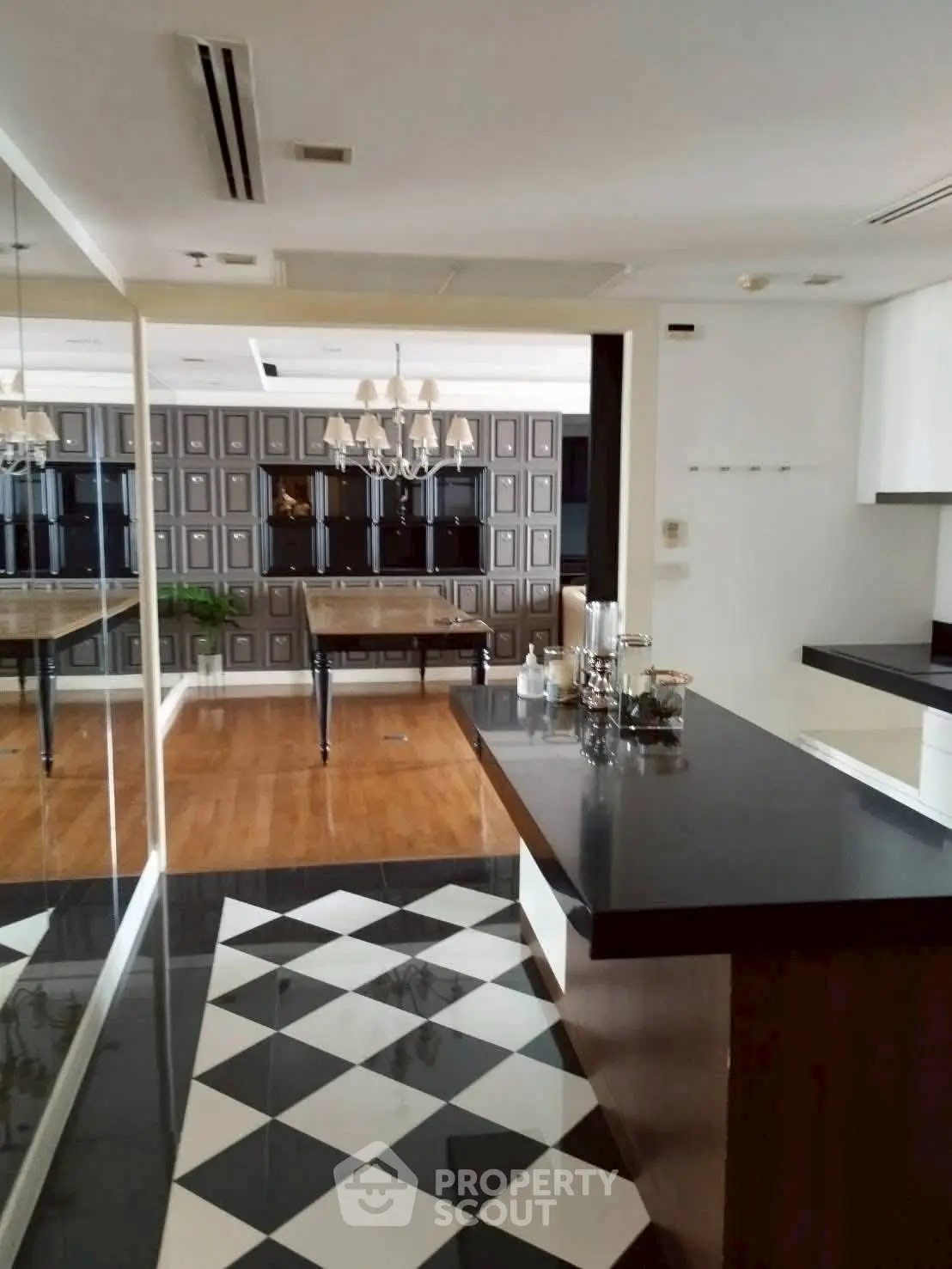 Luxurious modern interior with elegant black and white flooring and stylish decor