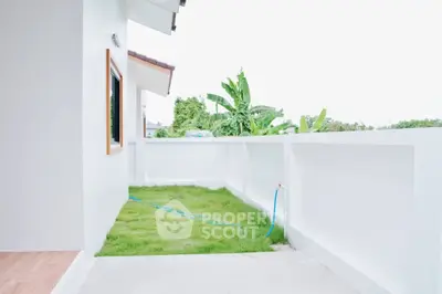 Spacious balcony with lush greenery and modern design