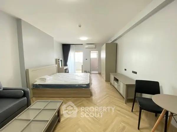 Spacious modern bedroom with minimalist design and natural light