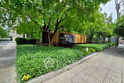 Lush green garden entrance of modern residential building