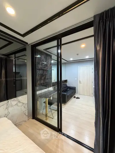 Modern apartment interior with sliding glass doors and elegant decor
