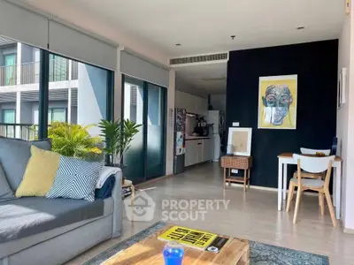 Modern living room with stylish decor and open kitchen in a bright apartment