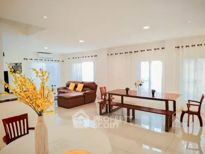 Spacious and bright living room with modern furniture and elegant decor