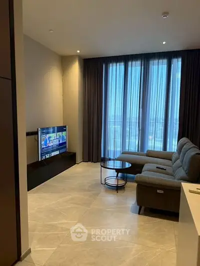 Modern living room with large windows and stylish furniture