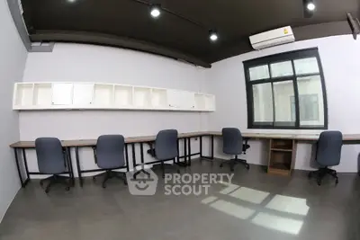 Modern office space with sleek desks and ergonomic chairs, perfect for productivity.