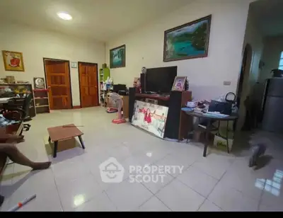 Spacious living room with tiled floor and modern decor