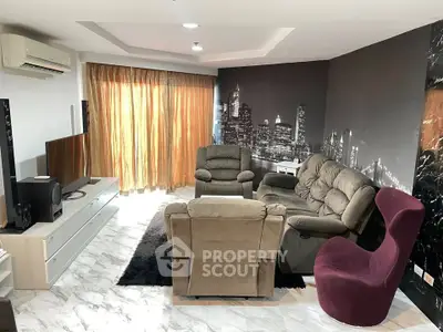 Spacious living room with modern decor and cityscape mural, featuring plush seating and elegant lighting.