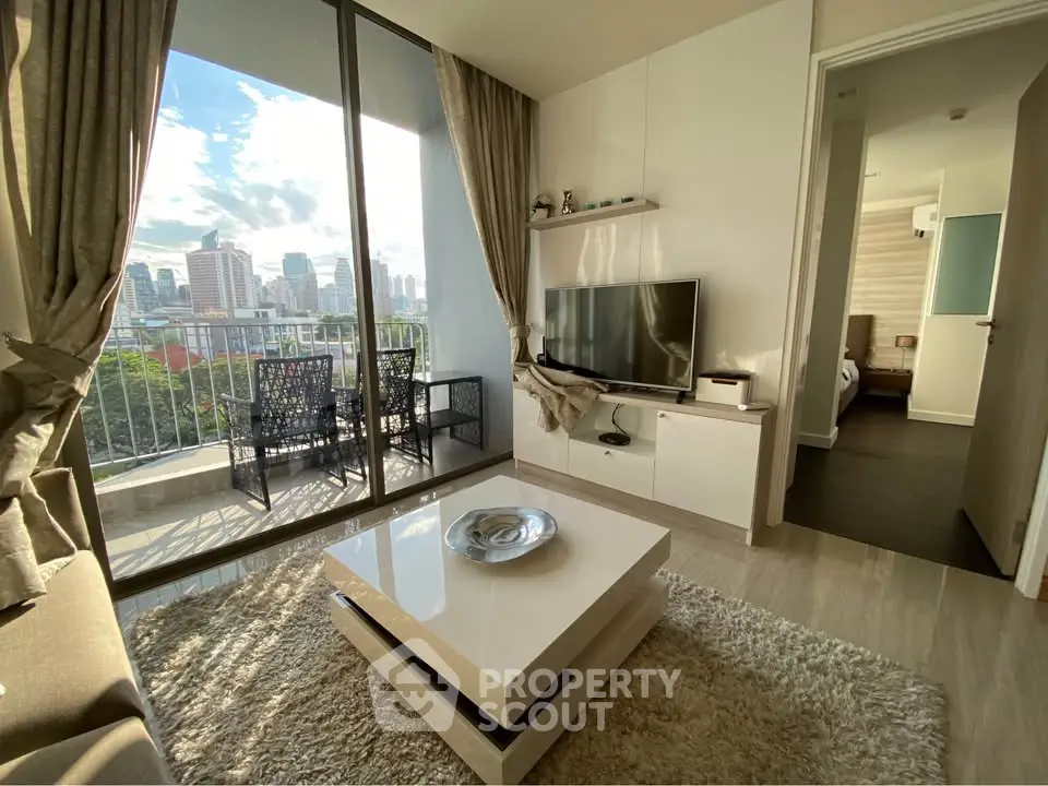 Modern living room with balcony view in urban apartment
