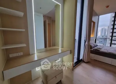 Modern bedroom with floor-to-ceiling windows and stylish vanity area