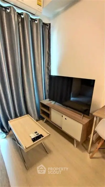 Modern living room with sleek TV setup and stylish furniture