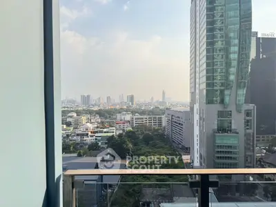 Stunning cityscape view from a modern high-rise balcony, perfect for urban living.